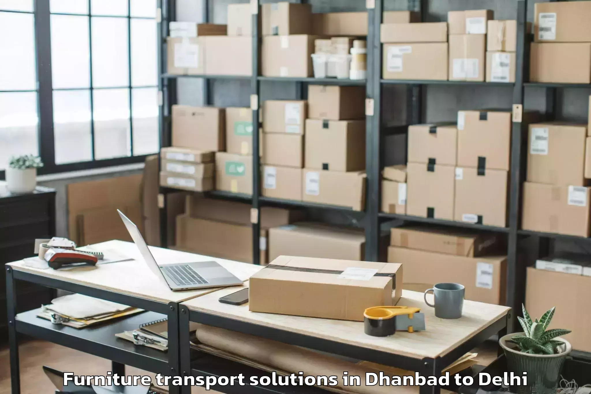 Expert Dhanbad to Defence Colony Furniture Transport Solutions